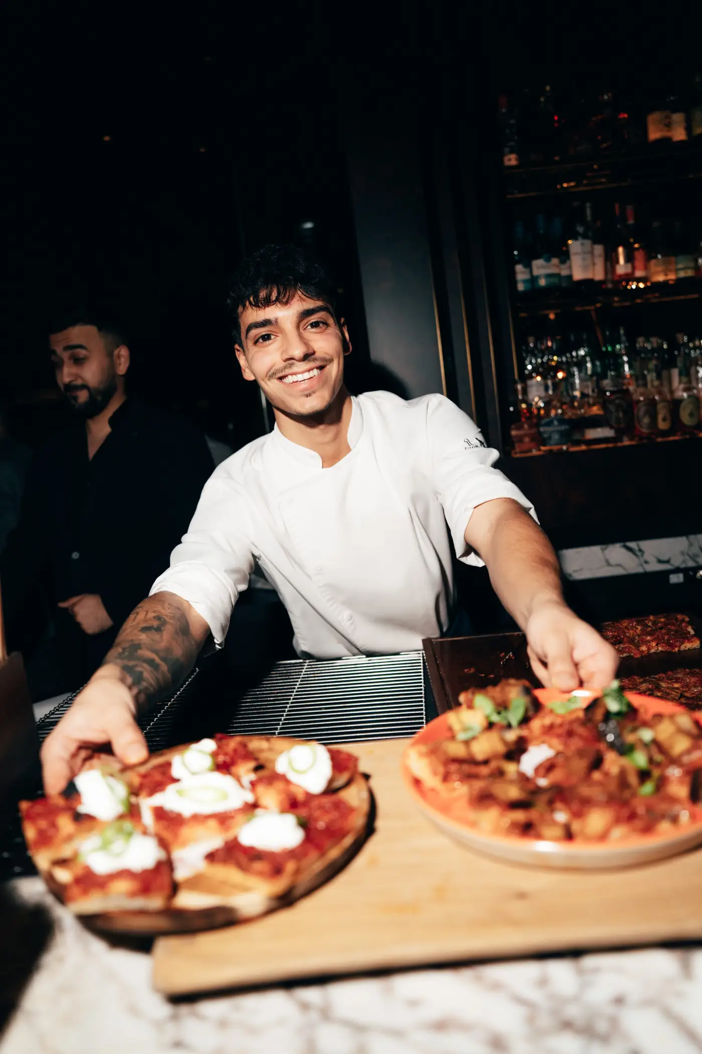 APERIPIZZA CHEF HOLDING PIZZAS